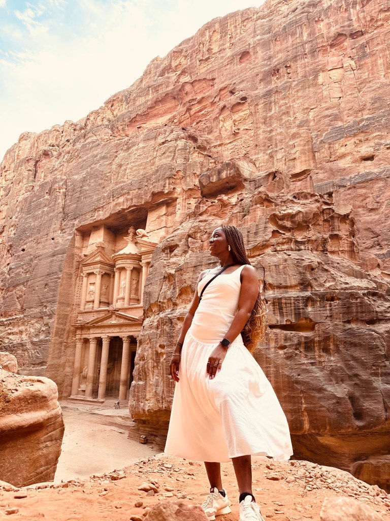 solo female traveler in Petra, Jordan, in front of a world wonder